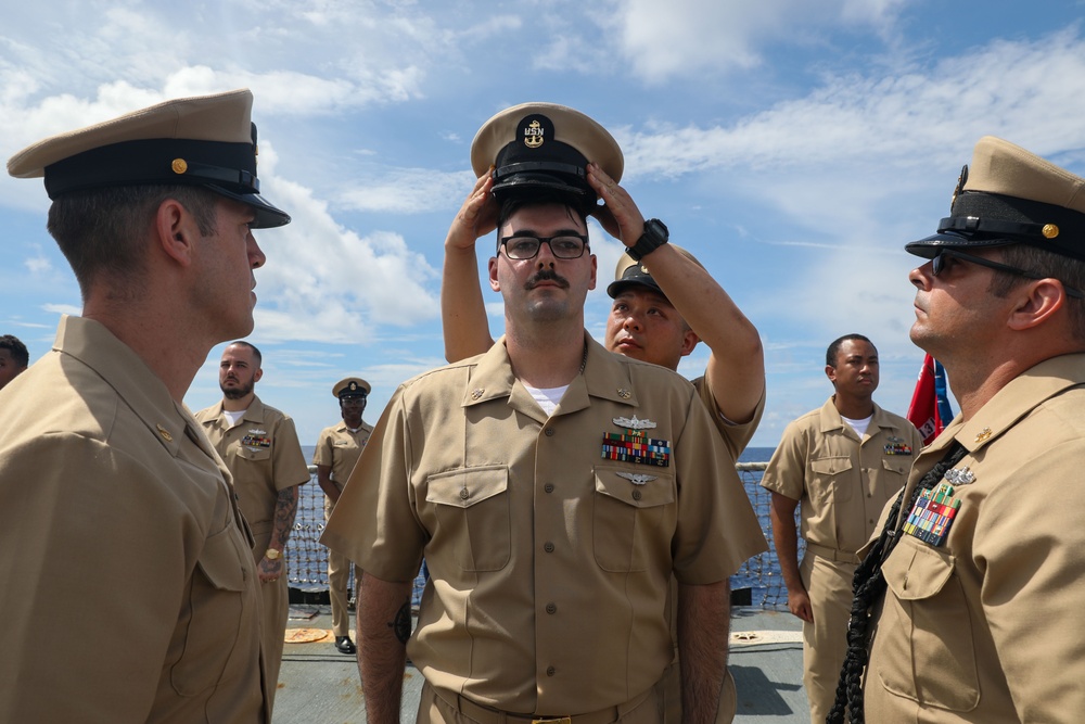 Sailors aboard the USS Howard conduct a Chief Petty Officer Pinning Ceremony in the South China Sea