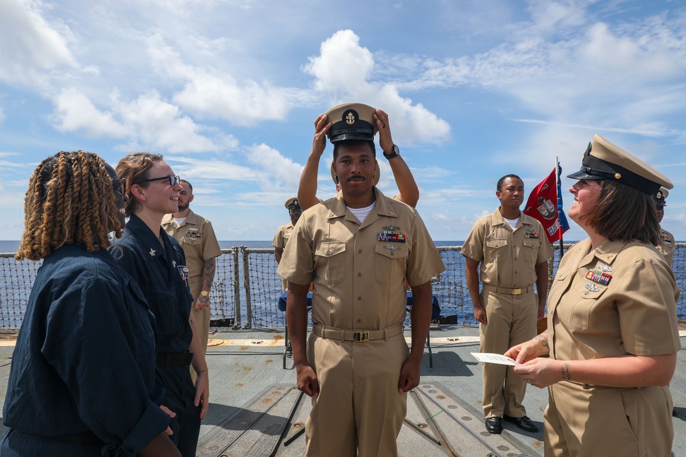 Sailors aboard the USS Howard conduct a Chief Petty Officer Pinning Ceremony in the South China Sea