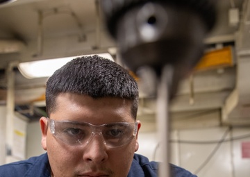 USS George Washington Sailors conduct maintenance and repairs