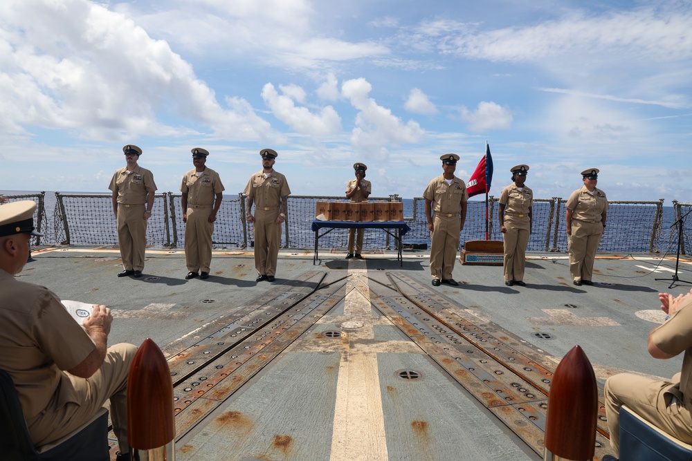 Sailors aboard the USS Howard conduct a Chief Petty Officer Pinning in the South China Sea