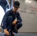 USS Tripoli Sailors Preform ship maintenance