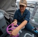 USS Tripoli Sailors Preform ship maintenance