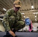 USS Tripoli Sailors Preform ship maintenance