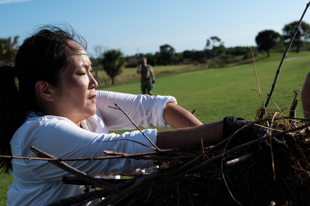 Volunteers and Staff clean up MacDill AFB Golf course following Hurricane Helene