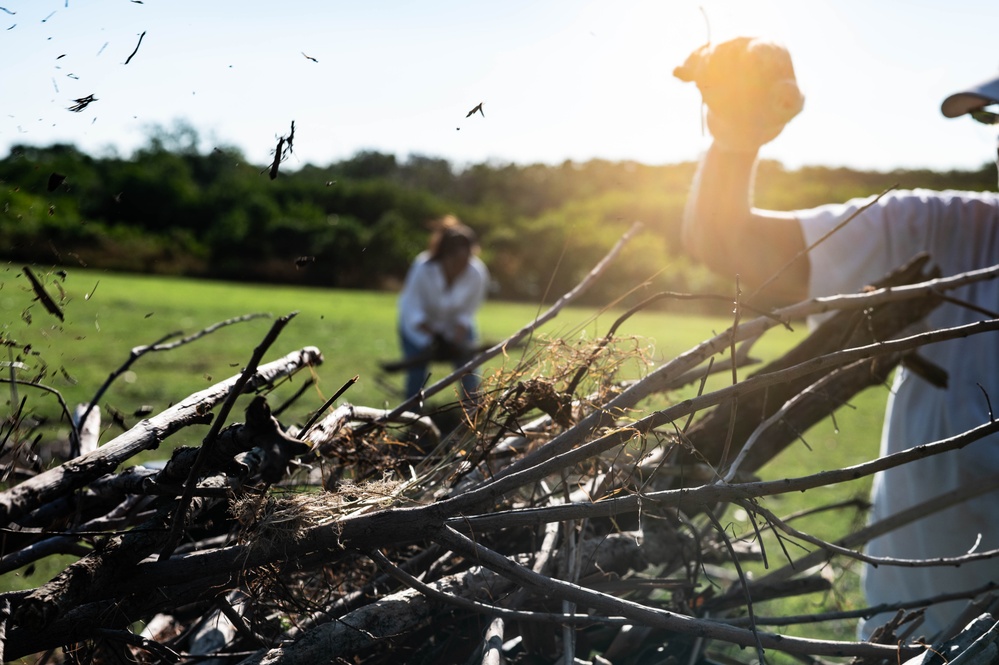 Volunteers and Staff clean up MacDill AFB Golf course following Hurricane Helene
