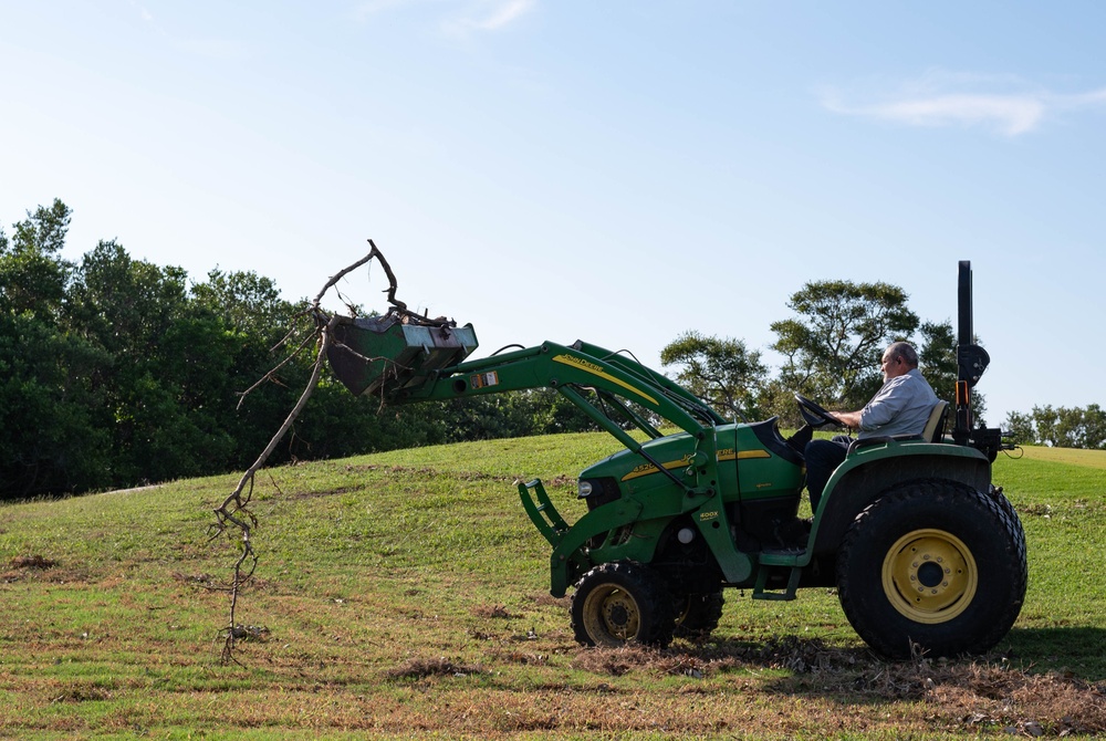 Volunteers and Staff clean up MacDill AFB Golf course following Hurricane Helene