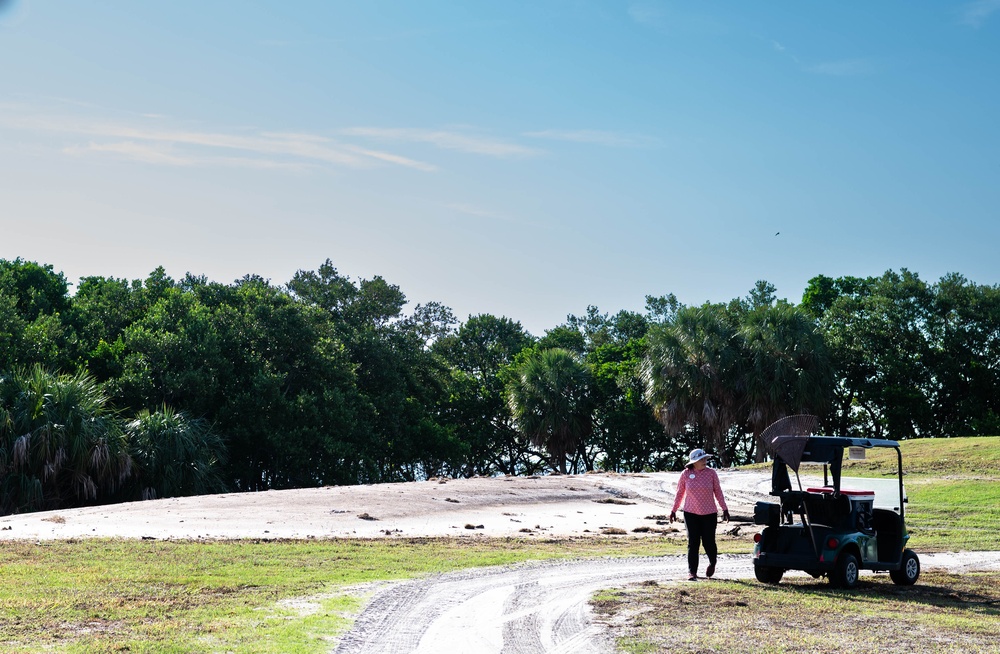Volunteers and Staff clean up MacDill AFB Golf course following Hurricane Helene