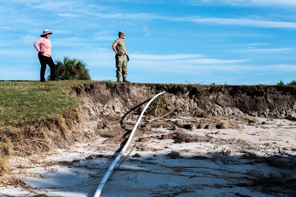 Volunteers and Staff clean up MacDill AFB Golf course following Hurricane Helene