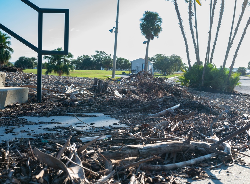 Volunteers and Staff clean up MacDill AFB Golf course following Hurricane Helene