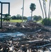 Volunteers and Staff clean up MacDill AFB Golf course following Hurricane Helene