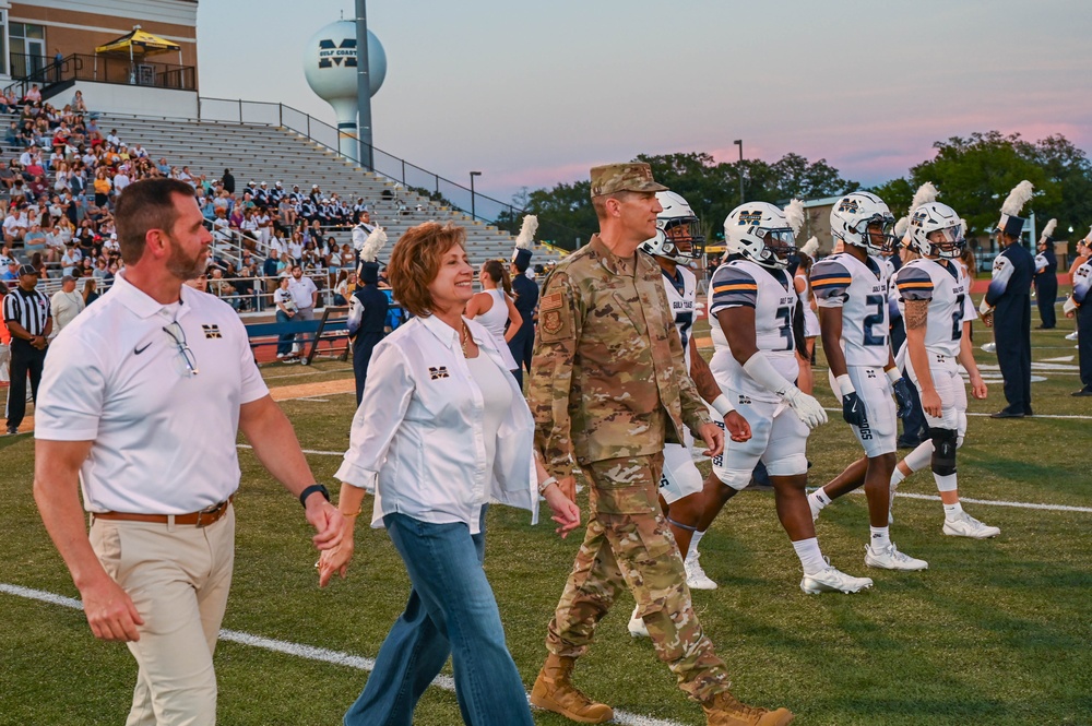 81st Training Wing Commander Leads Community Spirit with Coin Toss at Local College Football Game