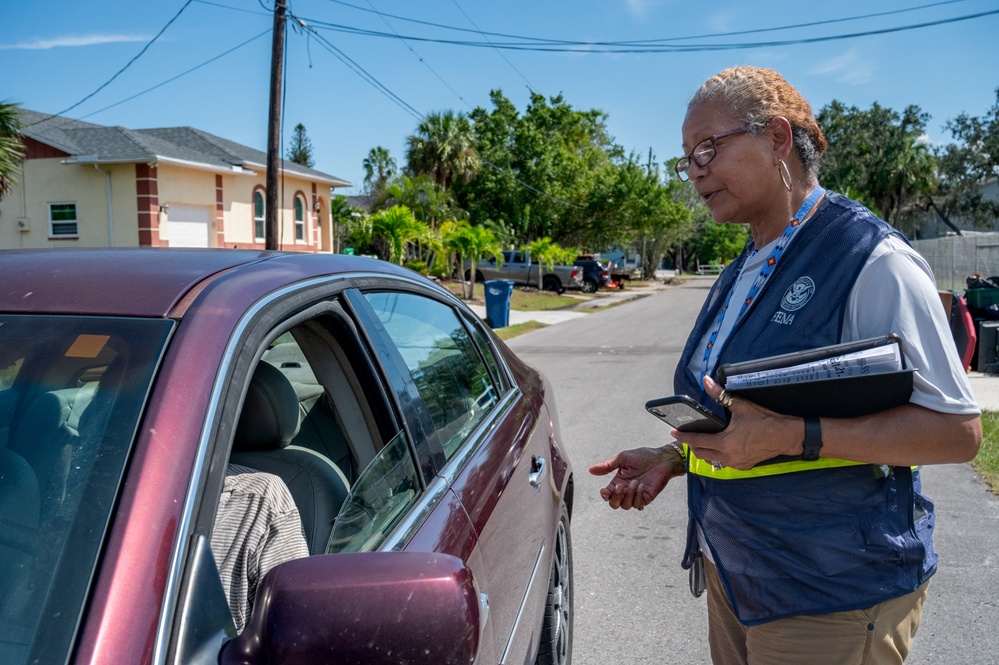 FEMA Disaster Survivor Assistance worker helps residents in hard-hit Rubonia, FL