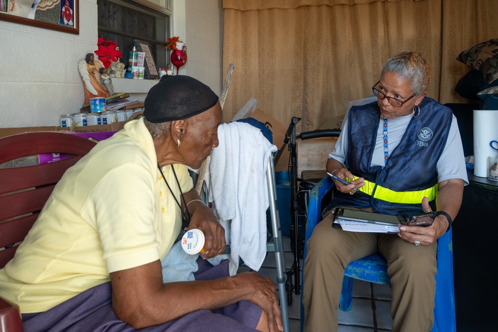 FEMA Disaster Survivor Assistance worker helps residents in hard-hit Rubonia, FL