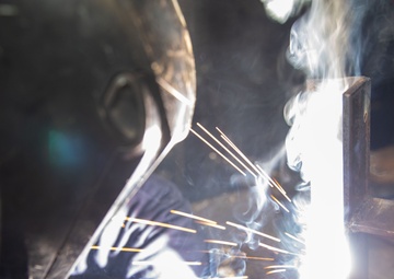 George Washington Sailor welds metal