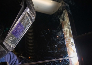 George Washington Sailor welds metal