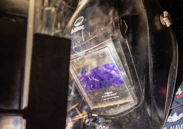 George Washington Sailor welds metal