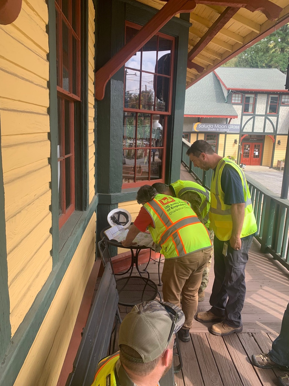 249th EN BN, USACE, and EPA using an atlas to find remote locations near Saluda, NC. (249th Soldier pictured is SSG Bylander)
