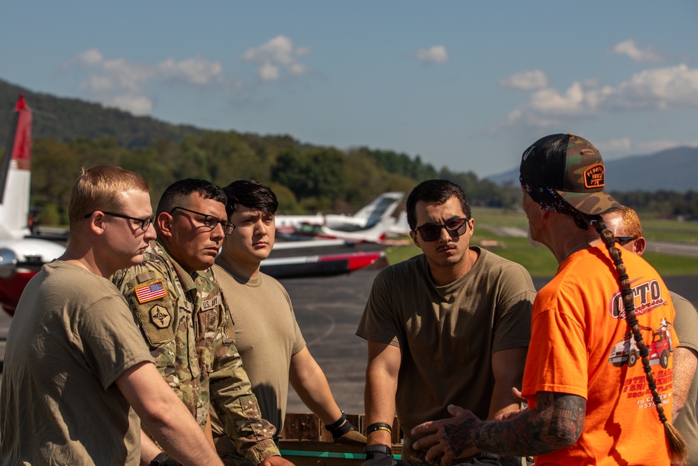 Tennessee Army National Guard and volunteers assist in unloading supplies at Elizabethton Airport