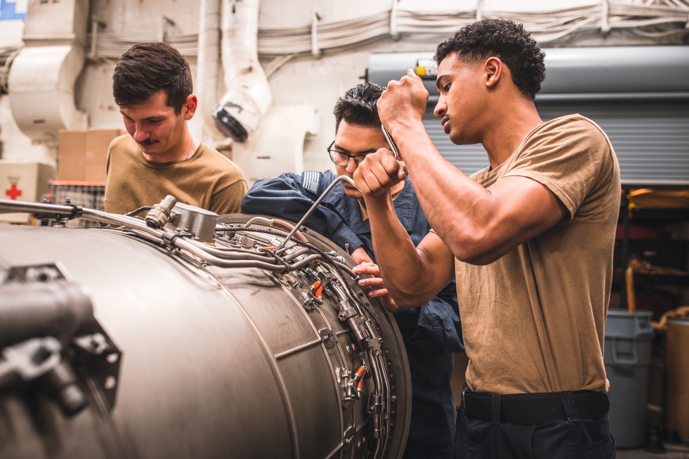 USS George Washington Sailors maintain aircraft.