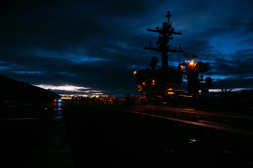 Theodore Roosevelt Transits the Pacific Ocean During Sunrise