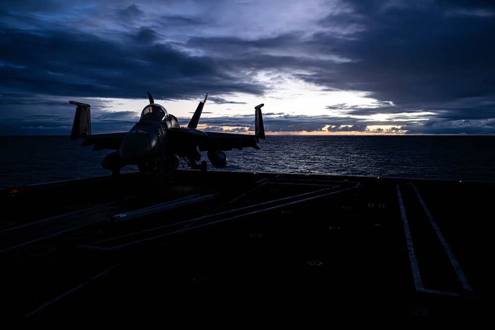 Theodore Roosevelt Transits the Pacific Ocean During Sunrise