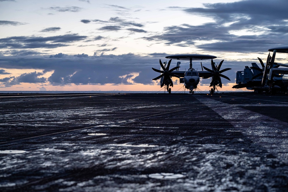 Theodore Roosevelt Transits the Pacific Ocean During Sunrise