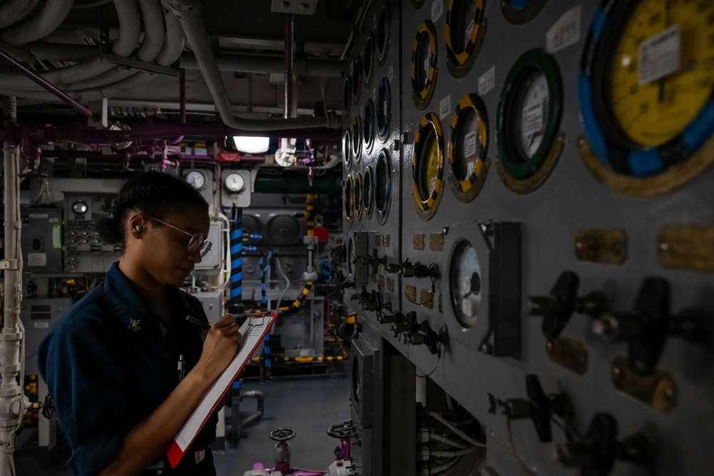 Theodore Roosevelt Engineman Checks Gauges