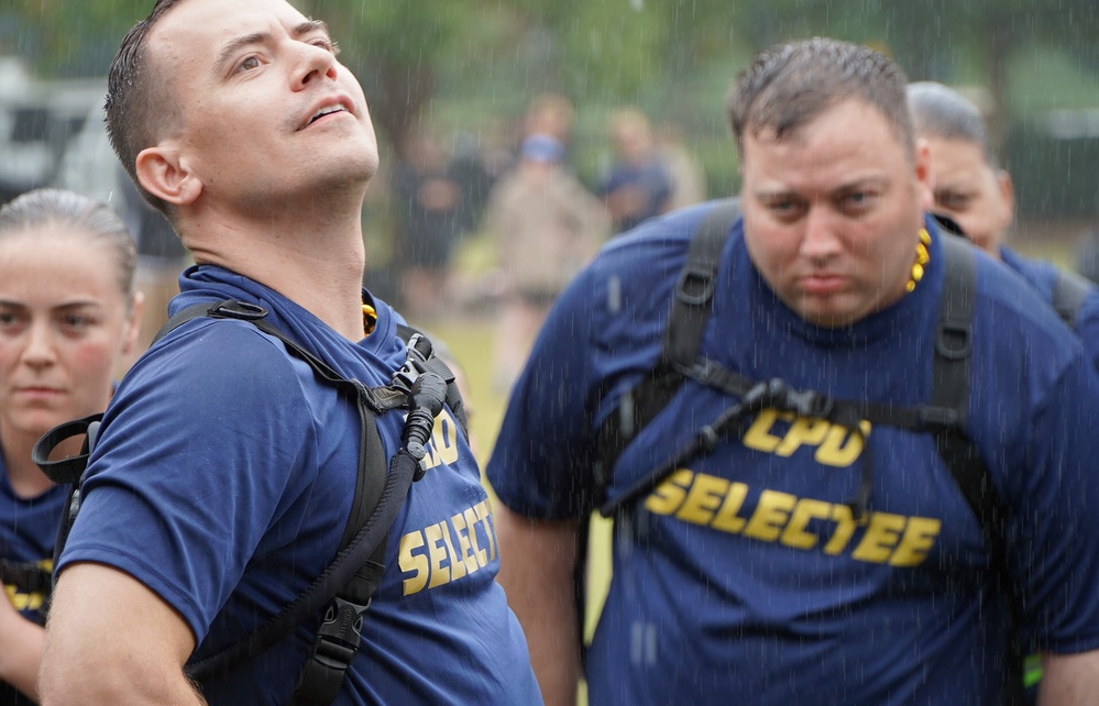 Dam Neck Annex CPO Selects compete in cadence and guidon competition in the pouring rain