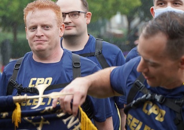 Dam Neck Annex CPO Selects compete in cadence and guidon competition in the pouring rain