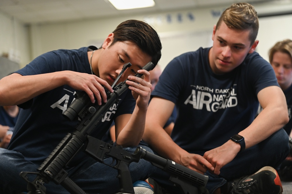 Enlistees with the 119th Wing practice rifle assembly