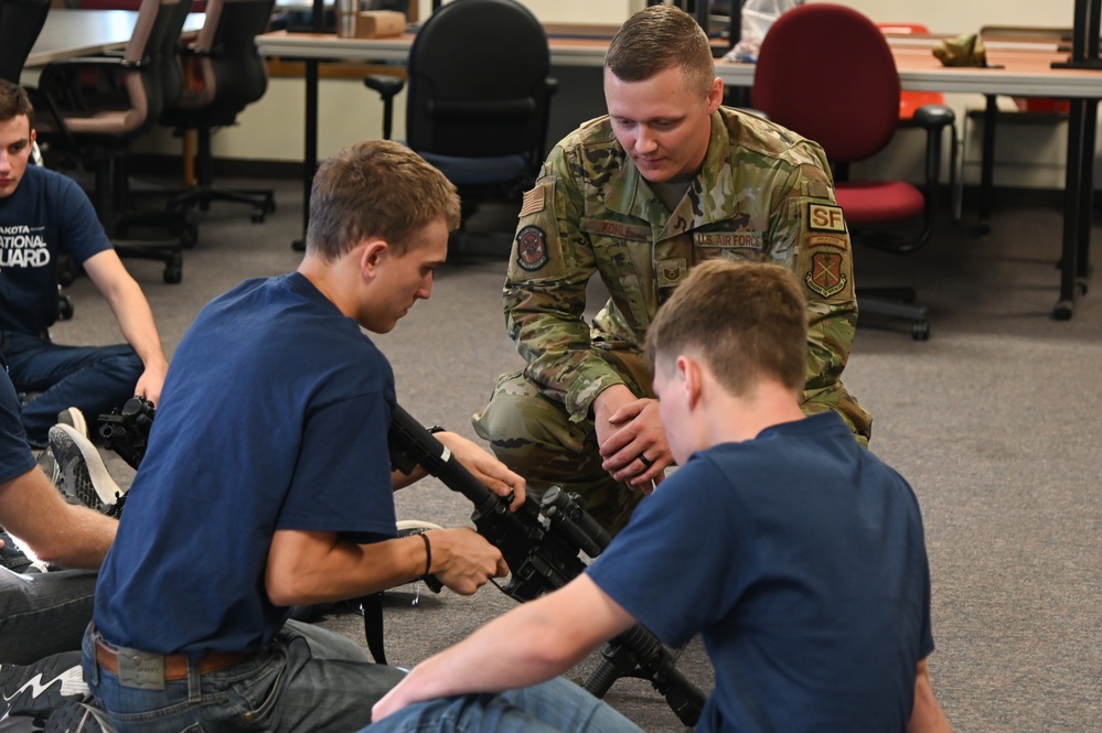 Enlistees with the 119th Wing practice rifle assembly