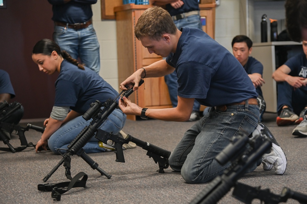 Enlistees with the 119th Wing practice rifle assembly