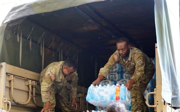 Active duty soldiers from the 82nd Airborne and the 20th Engineer Brigade from Fort Liberty, North Carolina, transported three 5-ton MTVs worth of food and water to the French Broad Fire and Rescue station.