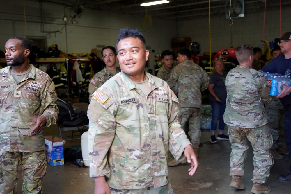 Active duty soldiers from the 82nd Airborne and the 20th Engineer Brigade from Fort Liberty, North Carolina, transported three 5-ton MTVs worth of food and water to the French Broad Fire and Rescue station.