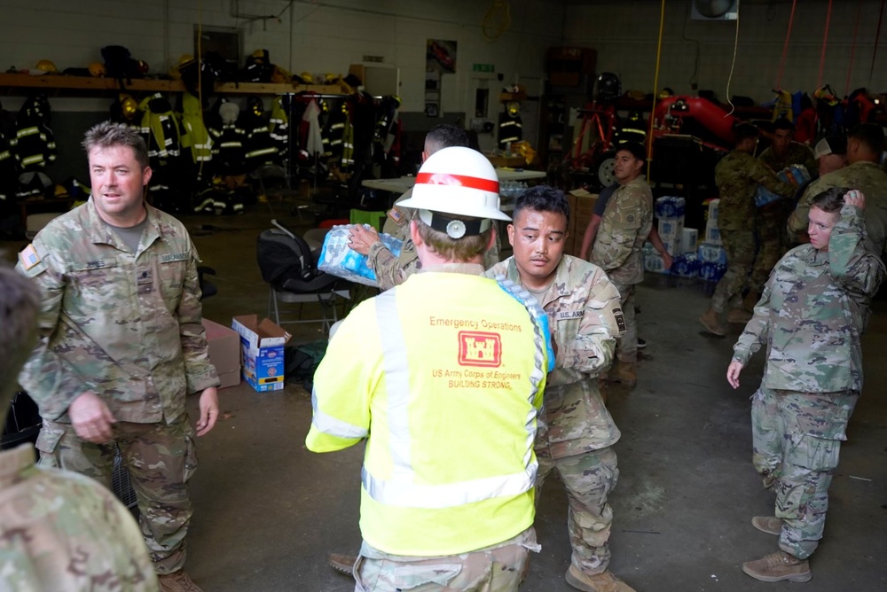 Active duty soldiers from the 82nd Airborne and the 20th Engineer Brigade from Fort Liberty, North Carolina, transported three 5-ton MTVs worth of food and water to the French Broad Fire and Rescue station.