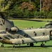 A U.S. Army CH-47 “Chinook” helicopter and its crew prepare to take-off from a campsite