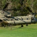 A U.S. Army CH-47 “Chinook” helicopter and its crew prepare to take-off from a campsite