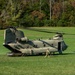 A U.S. Army CH-47 “Chinook” helicopter and its crew prepare to take-off from a campsite