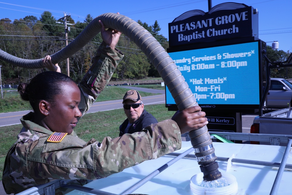 Tennessee Army National Guard Soldiers from Memphis distribute water to East TN