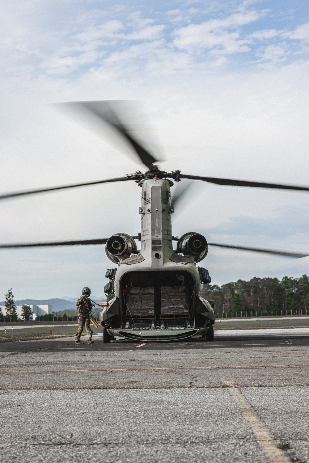 U.S. Army Soldiers, from the 82nd Airborne Division, prepare to board a CH-47 for deployment and distribution of food and supplies in support of Hurricane Helene relief efforts