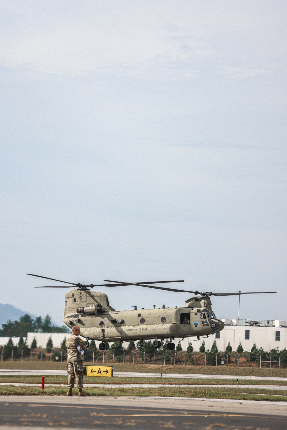 U.S. Army Soldiers, from the 82nd Airborne Division, prepare to board a CH-47 for deployment and distribution of food and supplies in support of Hurricane Helene relief efforts