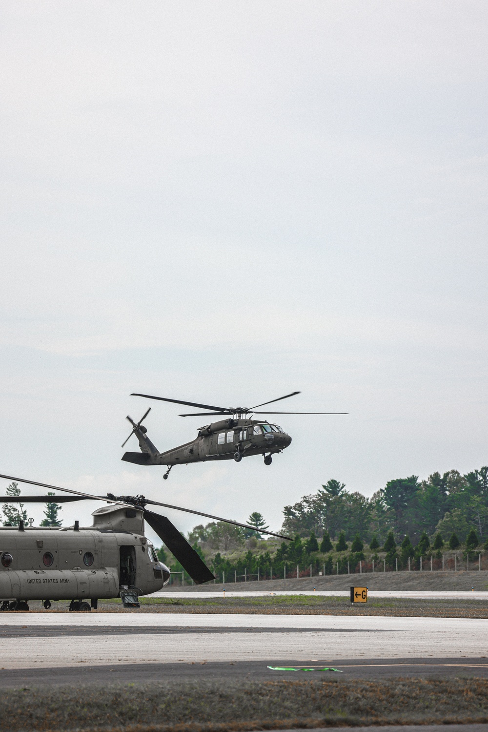 U.S. Army Soldiers, from the 82nd Airborne Division, prepare to board a CH-47 for deployment and distribution of food and supplies in support of Hurricane Helene relief efforts