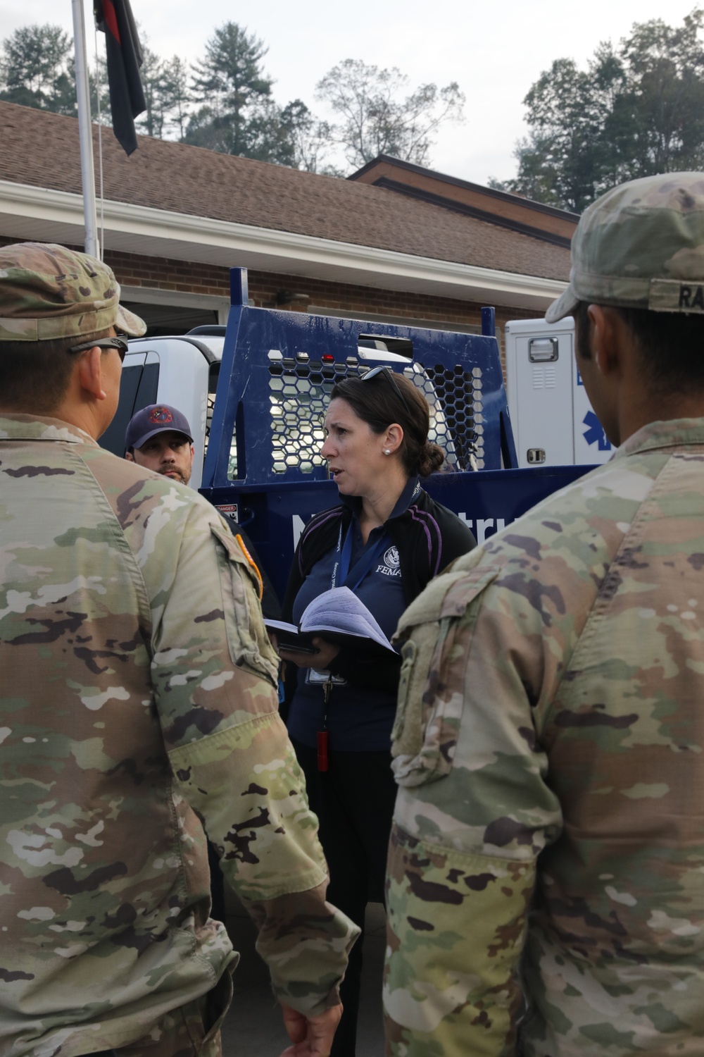 U.S. Army Soldiers, in support of FEMA during Hurricane Helene, deliver food, and water to civilians in need