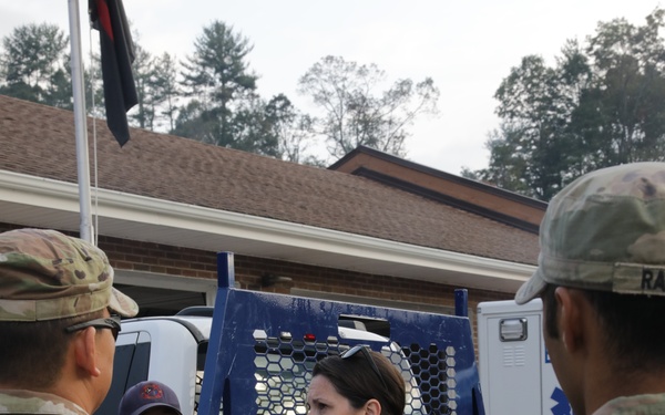 U.S. Army Soldiers, in support of FEMA during Hurricane Helene, deliver food, and water to civilians in need