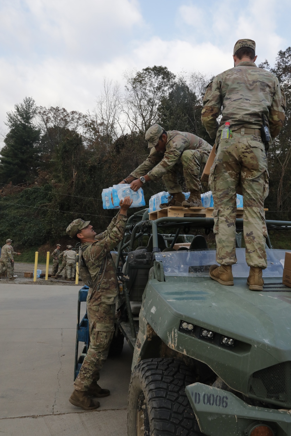 U.S. Army Soldiers, in support of FEMA during Hurricane Helene, deliver food, and water to civilians in need