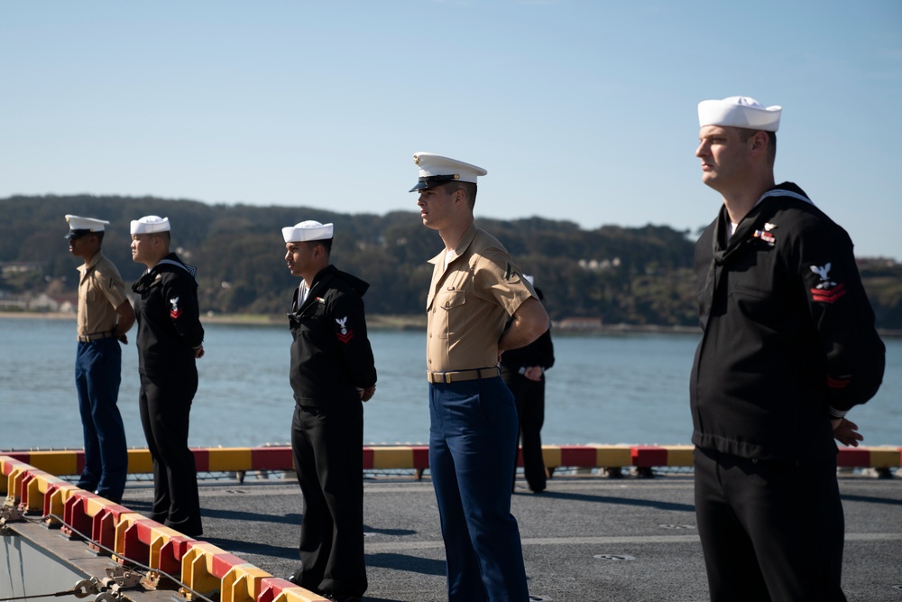 USS Tripoli Sailors man the rails while pullinig in to San Francisco