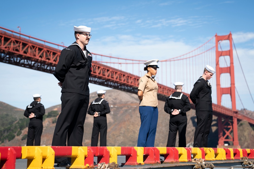 USS Tripoli Sailors man the rails while pullinig in to San Francisco