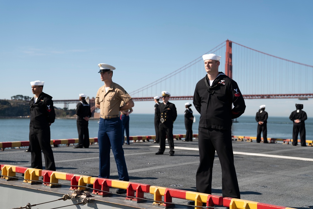 USS Tripoli Sailors man the rails while pullinig in to San Francisco