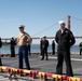 USS Tripoli Sailors man the rails while pullinig in to San Francisco