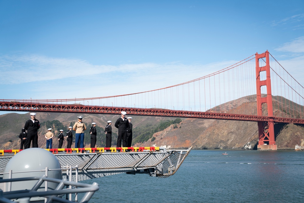 USS Tripoli Sailors man the rails while pullinig in to San Francisco